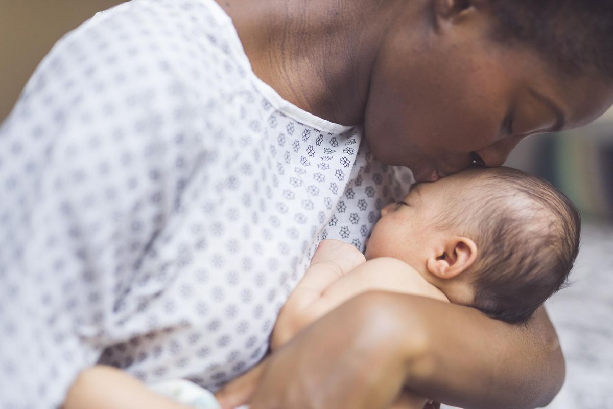 New Mom Holds Her Infant to Her Chest