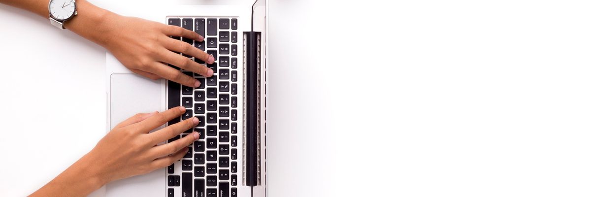 woman typing on a laptop