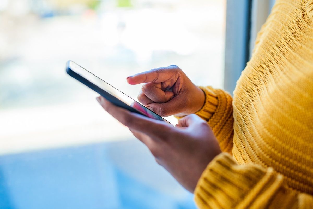 woman using a mobile phone indoors