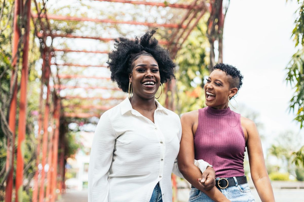 women stylish friends having fun walking in a park